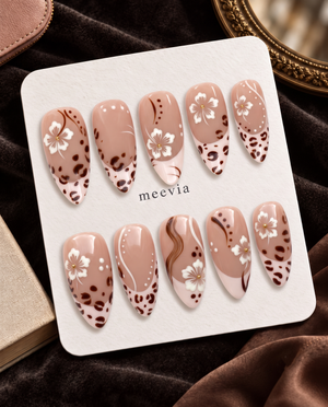 Brown floral leopard French tip press-on nails with glossy blush nude bases and white flowers