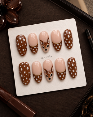 Brown glossy spotted deer press-on nails with nude sections and gold details