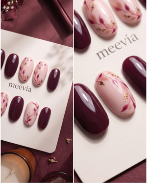 Burgundy and pink floral press-on nails with glossy finish and gold glitter accents
