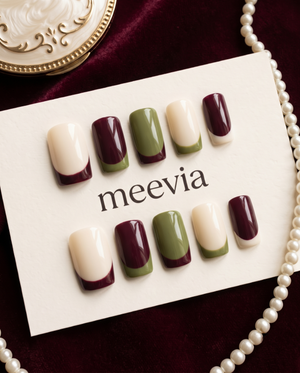 Burgundy, olive green, and cream French tip press-on nails with a glossy finish