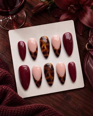 Burgundy and tortoiseshell French tip press-on nails with glossy finish