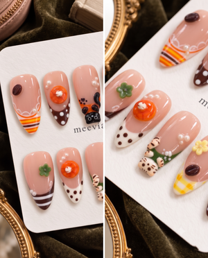 Glossy pink press-on nails with cat, dessert, flower, pearl, and gingham motifs