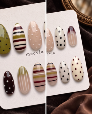 Mixed-pattern neutral press-on nails with olive, cream, nude, burgundy, black stripes and polka dots