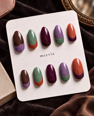 Multicolor glossy French tip press-on nails in brown, lavender, sage green, plum, and orange