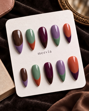 Multicolor glossy French tip press-on nails in brown, lavender, sage green, plum, and orange