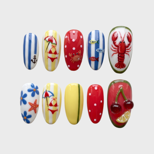 Nautical summer beach press-on nails featuring red lobster, crab, starfish, and 3D cherry designs.