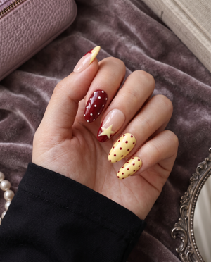 Red, yellow, and soft pink star and polka dot press-on nails