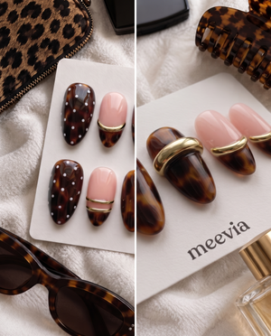 Brown tortoiseshell and pink press-on nails with gold bands and white dot details