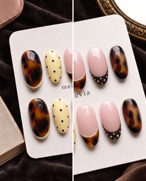 Tortoiseshell, pink French, and yellow polka dot press-on nails displayed on a white card