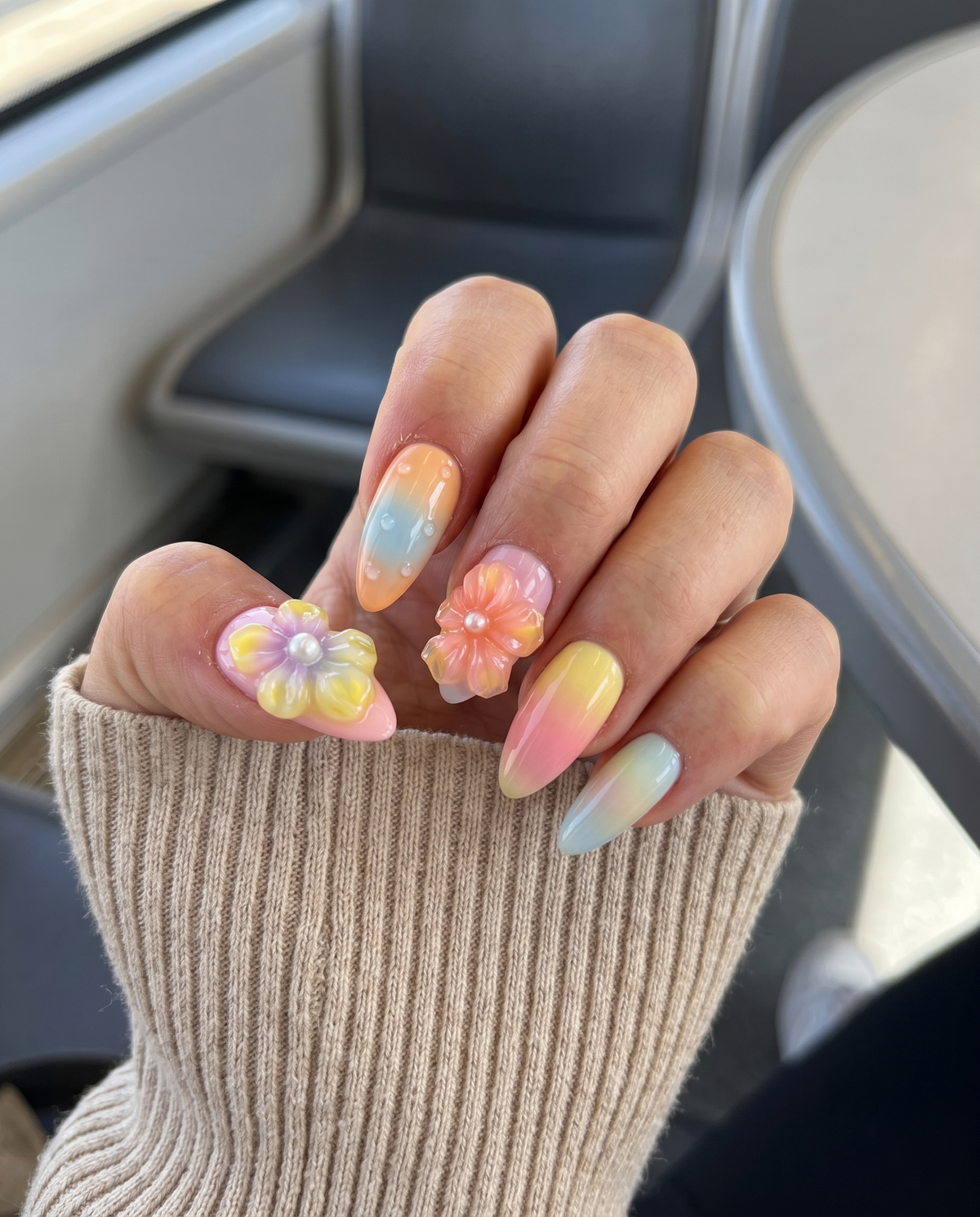 Pastel ombr������������ press-on nails with 3D jelly flowers, pearl centers, and clear water droplet accents.
