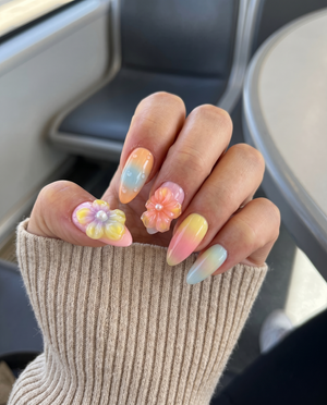 Pastel ombr������������ press-on nails with 3D jelly flowers, pearl centers, and clear water droplet accents.