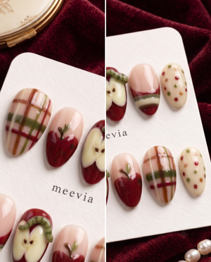 Apple-themed press-on nails with red apples, plaid stripes, cream accents, and colorful dots