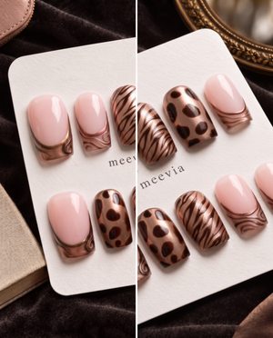 Bronze metallic French tip press-on nails with pink polish, zebra stripes, and brown animal print accents
