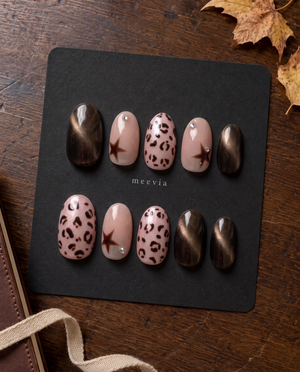 Brown cat-eye and pink leopard star press-on nails with silver rhinestones