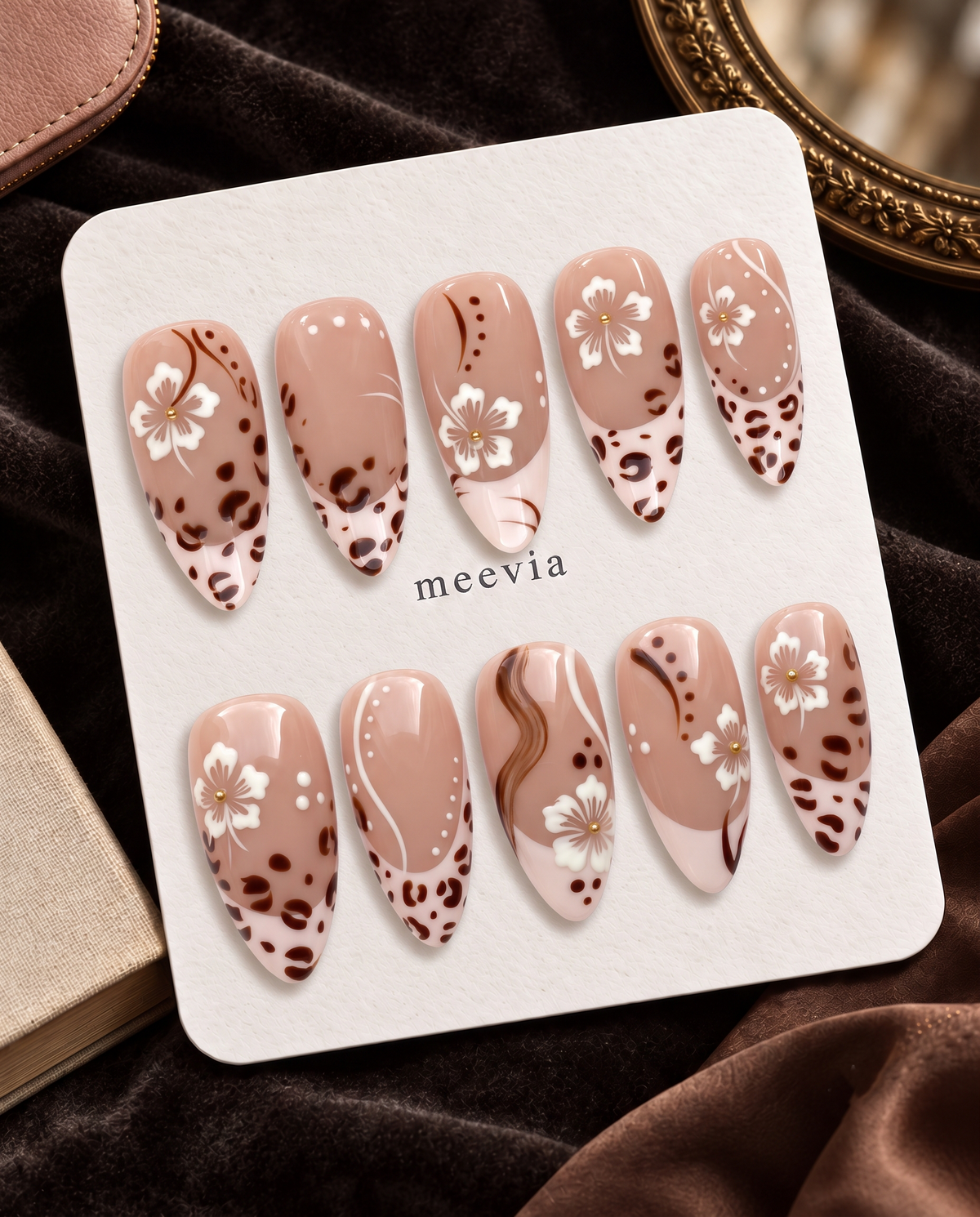 Brown floral leopard French tip press-on nails with glossy blush nude bases and white flowers
