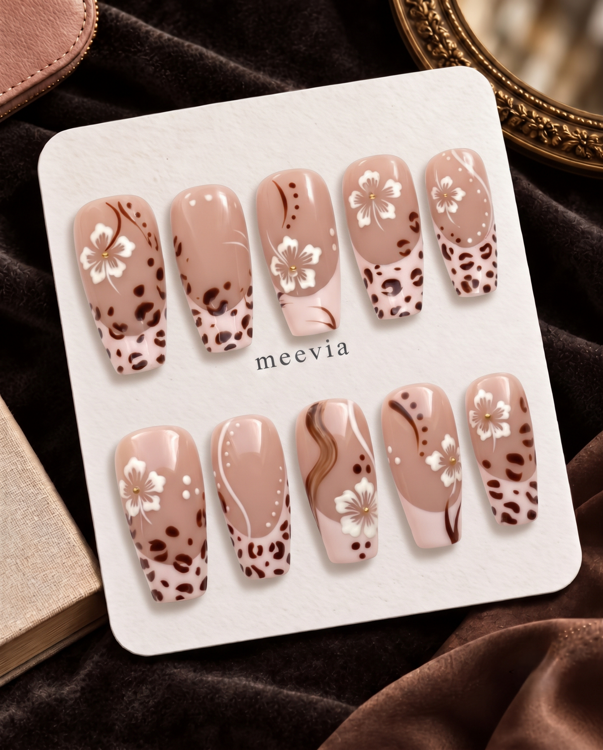 Brown floral leopard French tip press-on nails with glossy blush nude bases and white flowers