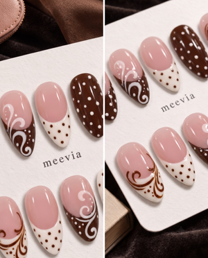 Brown and pink press-on nails with polka dots, French tips, and swirl designs