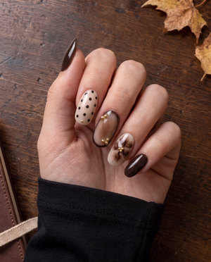 Brown and nude floral and polka dot press-on nails with gold bead accents
