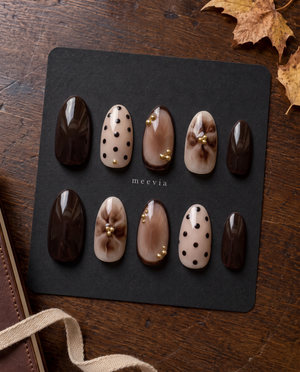 Brown and nude floral and polka dot press-on nails with gold bead accents