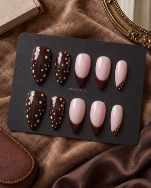Brown and blush pink press-on nails with white polka dots and brown French tips