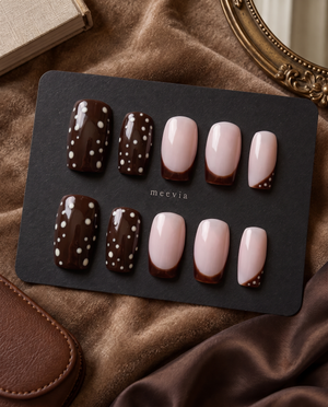 Brown and blush pink press-on nails with white polka dots and brown French tips