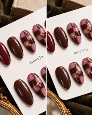Burgundy and brown glossy checkerboard press-on nails with gold accents
