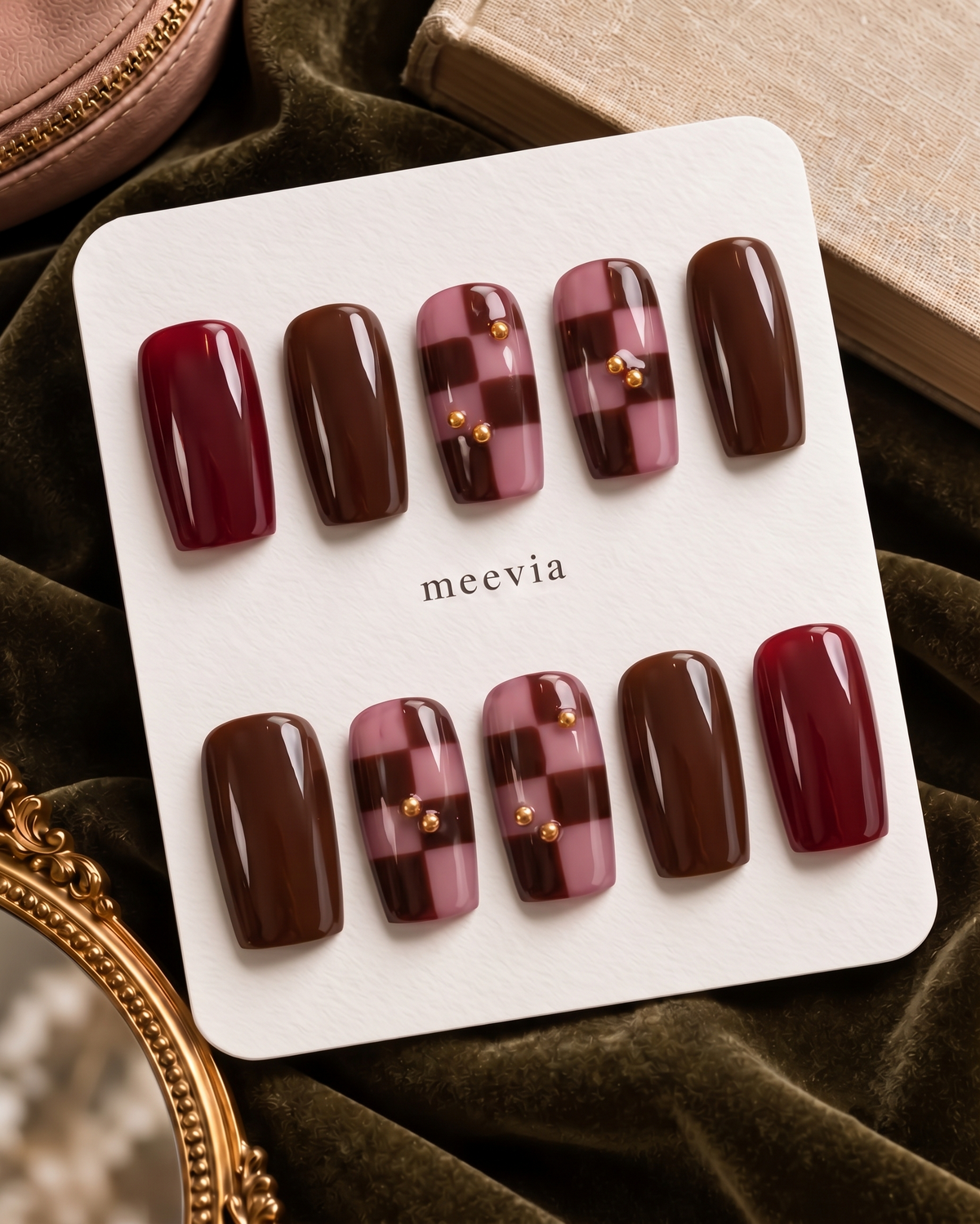 Burgundy and brown glossy checkerboard press-on nails with gold accents