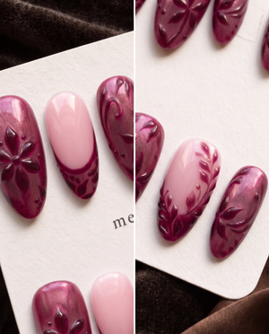 Burgundy and pink floral almond press-on nails displayed on a Meevia card