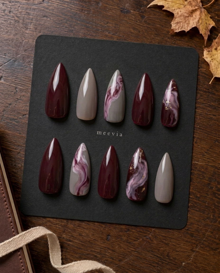 Burgundy and taupe glossy marble press-on nails with mauve swirls and gold flecks