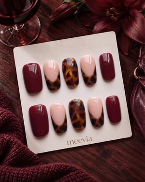 Burgundy and tortoiseshell French tip press-on nails with glossy finish