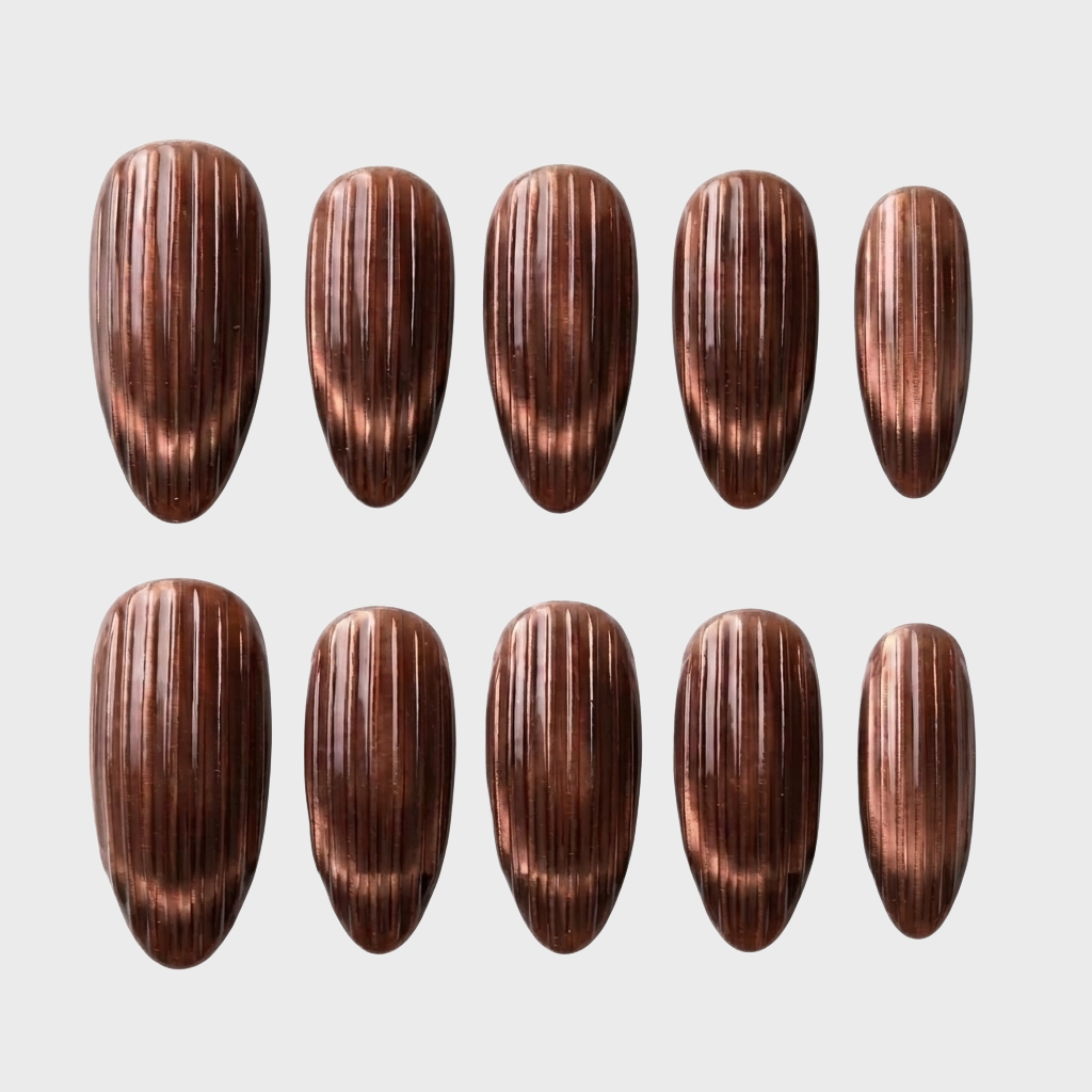 Ten chocolate brown press-on nails with a vertical ribbed texture arranged in two rows.