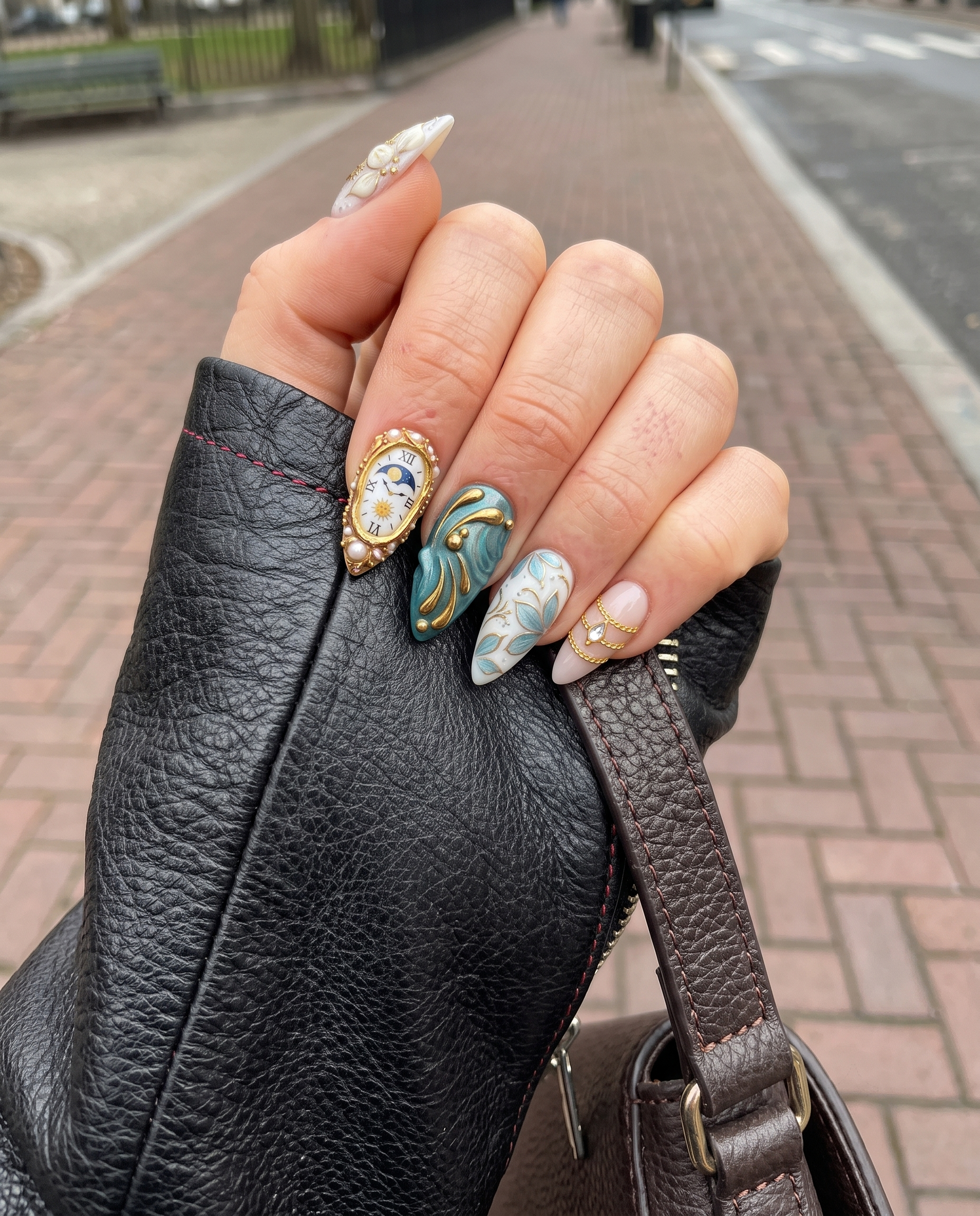 A set of stiletto press-on nails featuring clockwork, floral, and butterfly designs with gold accents.