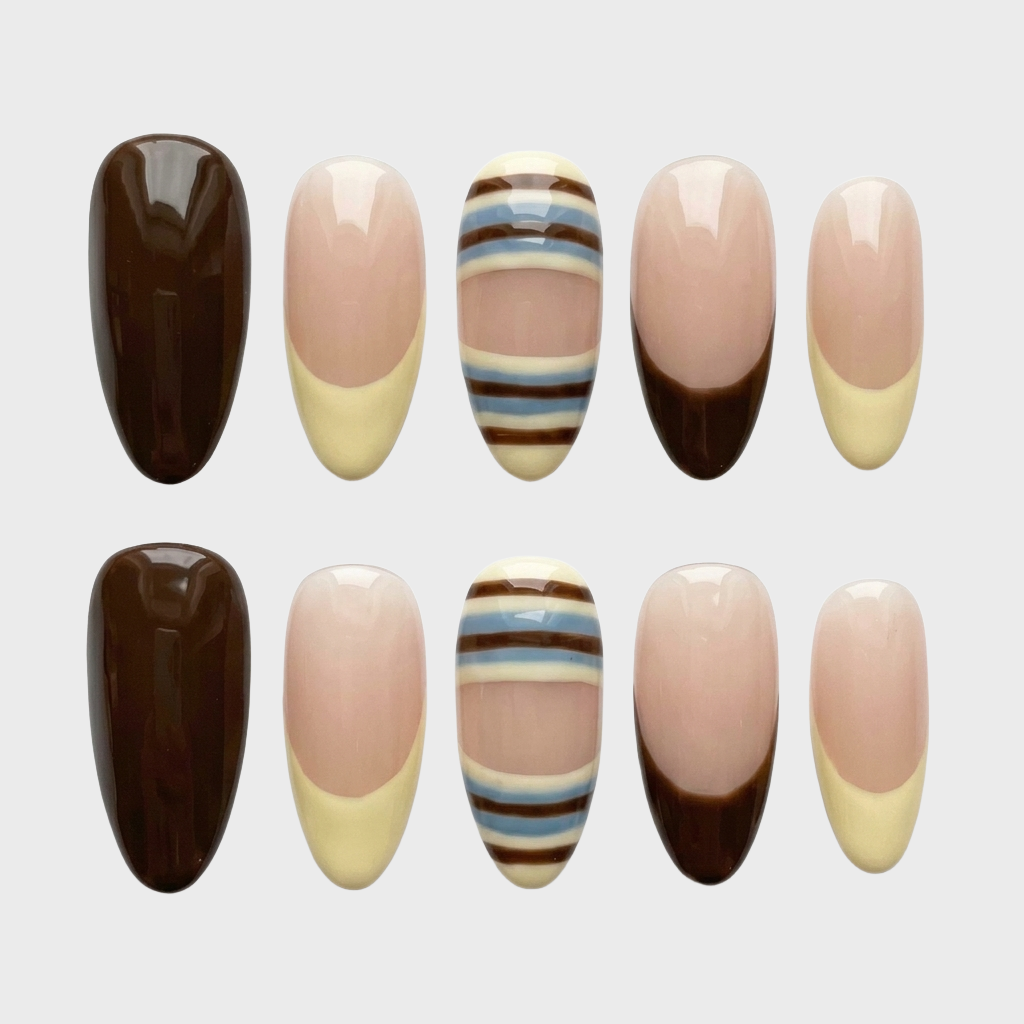 A set of press-on nails featuring mocha brown, cream, and blue striped designs with French tips.