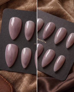 Glossy mauve taupe almond press-on nails displayed on a black nail card