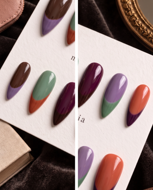 Multicolor glossy French tip press-on nails in brown, lavender, sage green, plum, and orange
