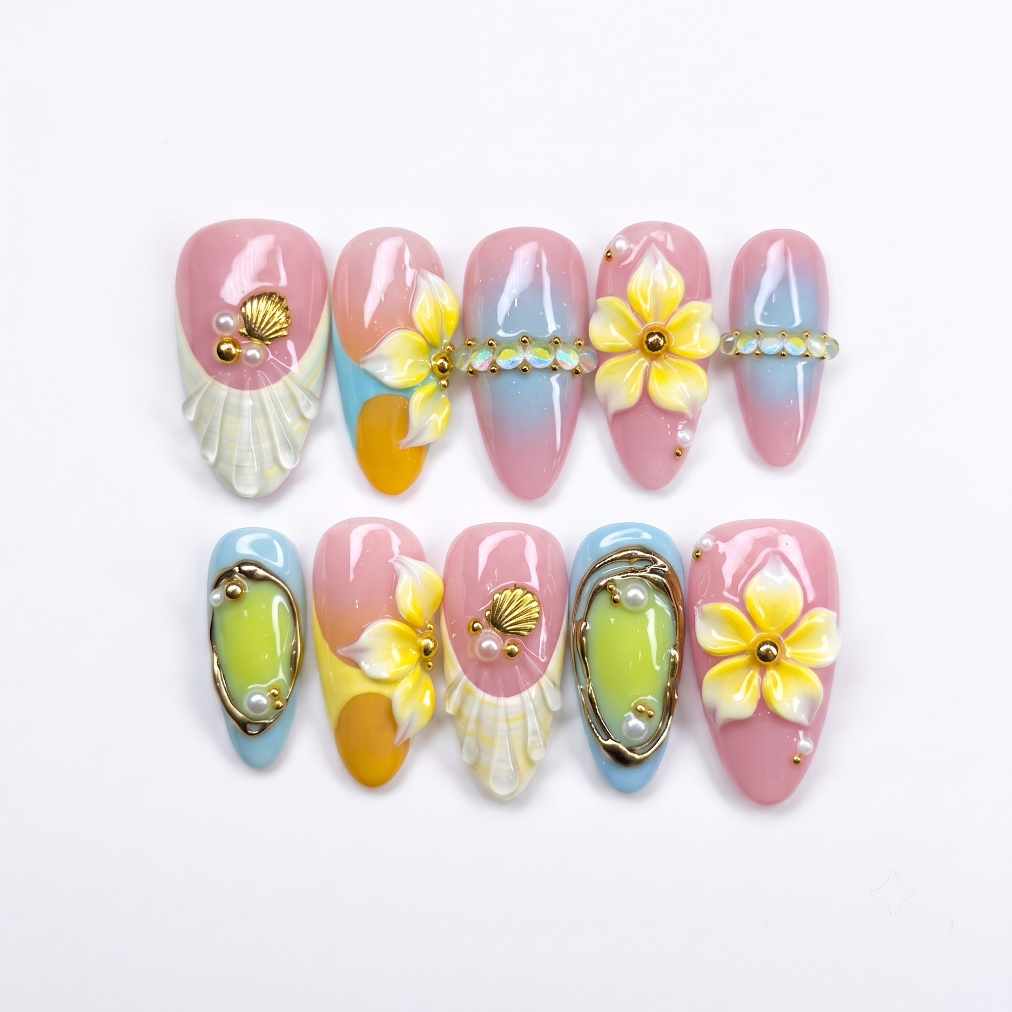 3D pastel press-on nails featuring yellow flowers, white seashells, gold accents, and a pink and blue gradient background.