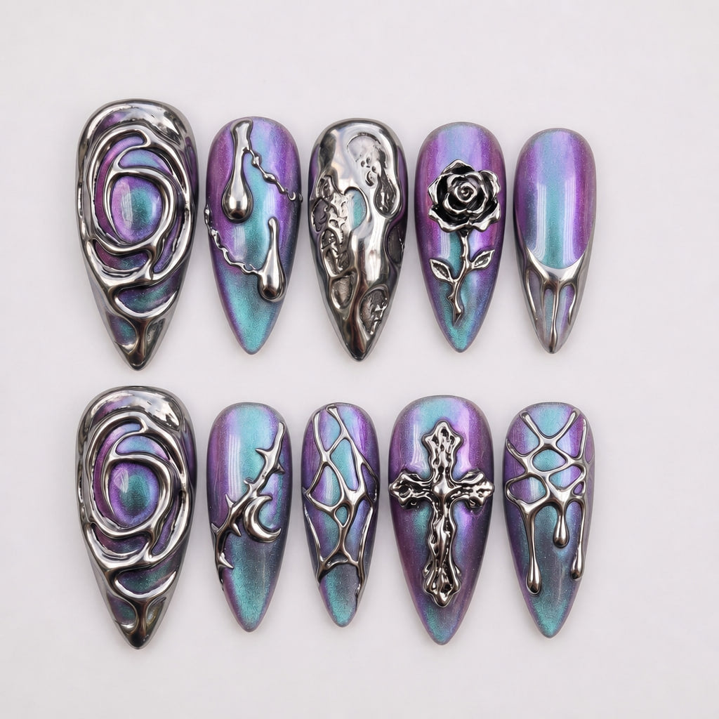 Set of press-on nails featuring a purple and teal cat-eye base with 3D chrome rose, cross, and liquid metal designs.