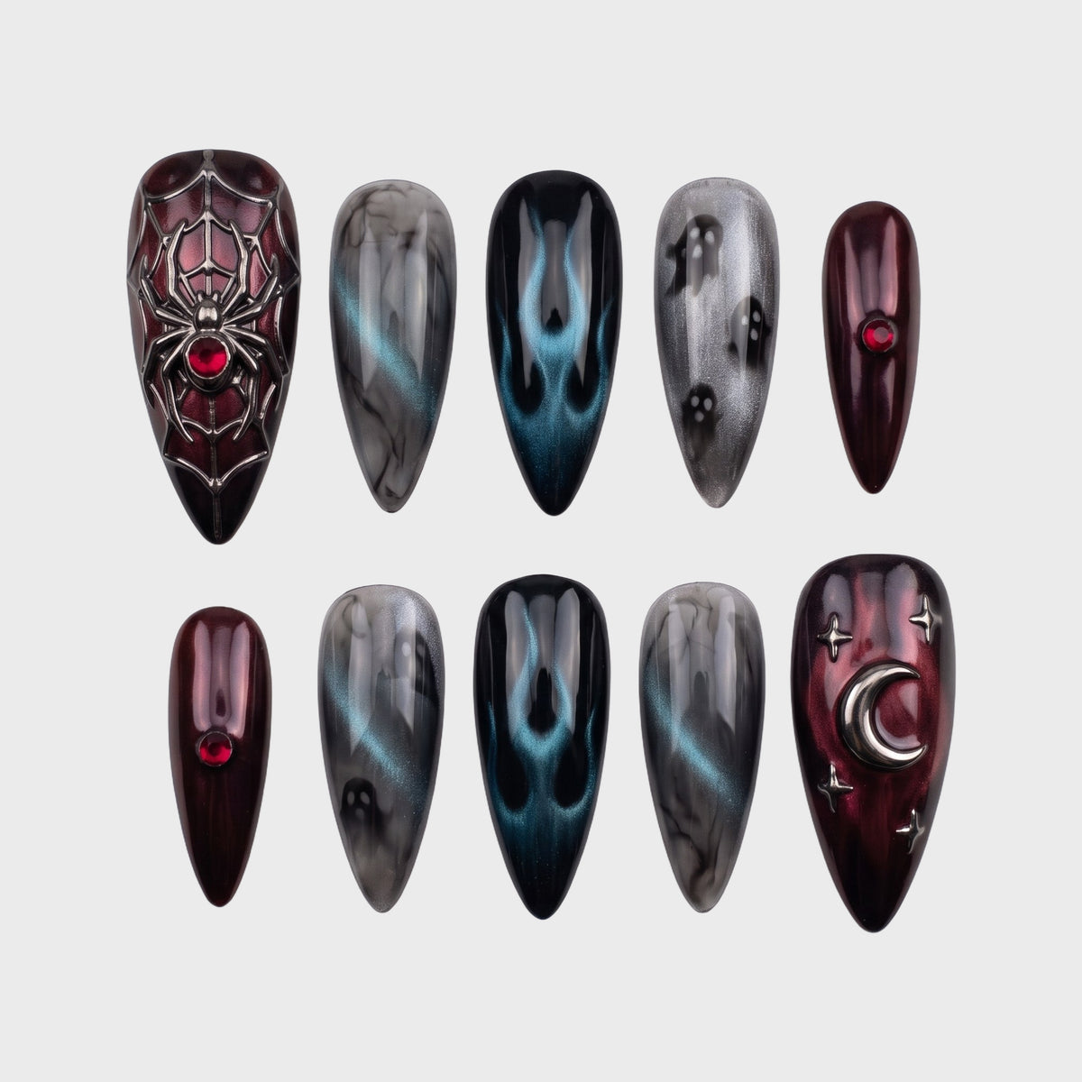 A set of gothic-themed stiletto press-on nails featuring spider webs, ghosts, flames, and moon charms in burgundy and grey tones.
