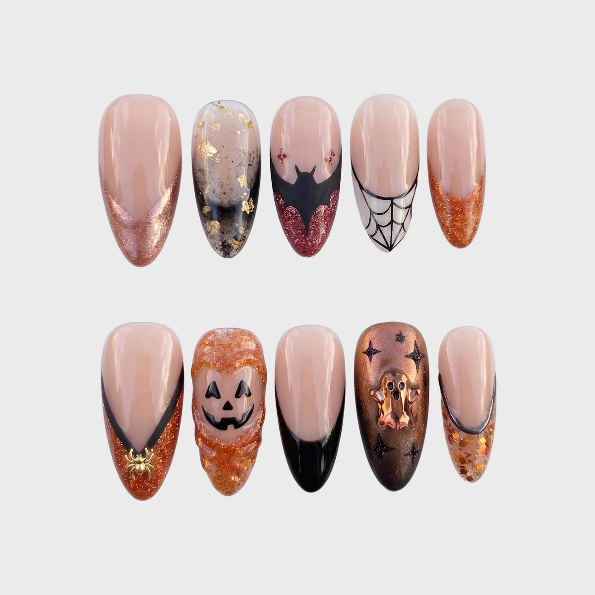 A set of Halloween-themed press-on nails featuring jack-o'-lanterns, ghosts, bats, and spiderwebs.