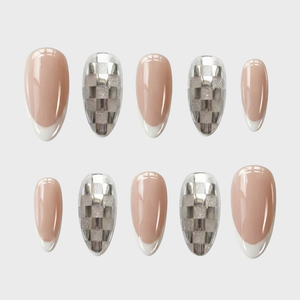 Silver metallic checkerboard and nude French tip press-on nails.