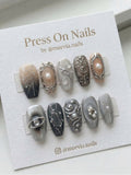 Long coffin-shaped grey press-on nail set with 3D silver filigree, pearls, and celestial moon motifs.