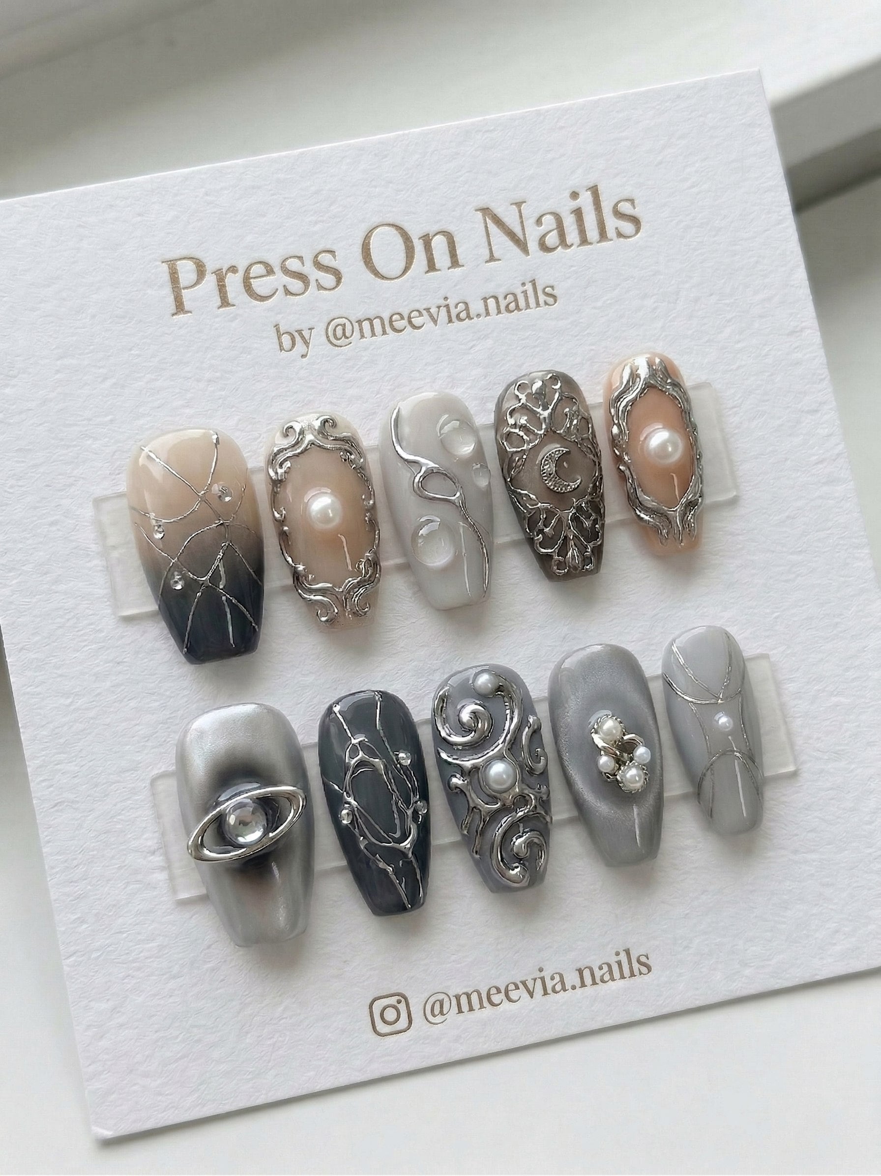 Long coffin-shaped grey press-on nail set with 3D silver filigree, pearls, and celestial moon motifs.