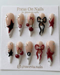 Long stiletto press-on nail set with 3D cherries, bows, stars, and billiard ball motifs.