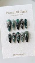 Long stiletto press on nails in emerald and black with 3D silver chrome art and rhinestones