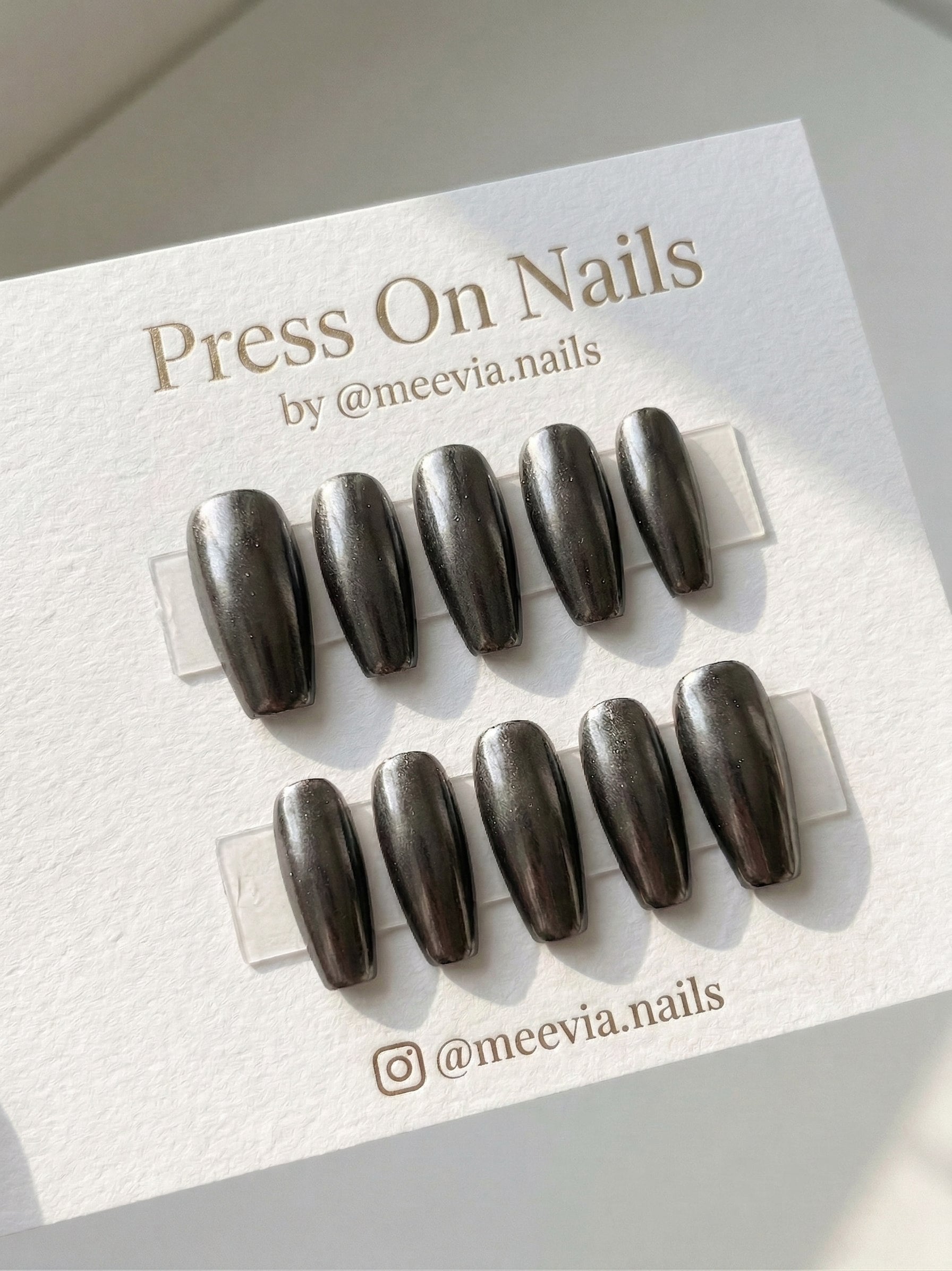 Long coffin-shaped gunmetal chrome press-on nail set with a metallic finish