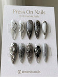 Long stiletto press-on nails with grey and silver 3D gothic nail art and chrome accents