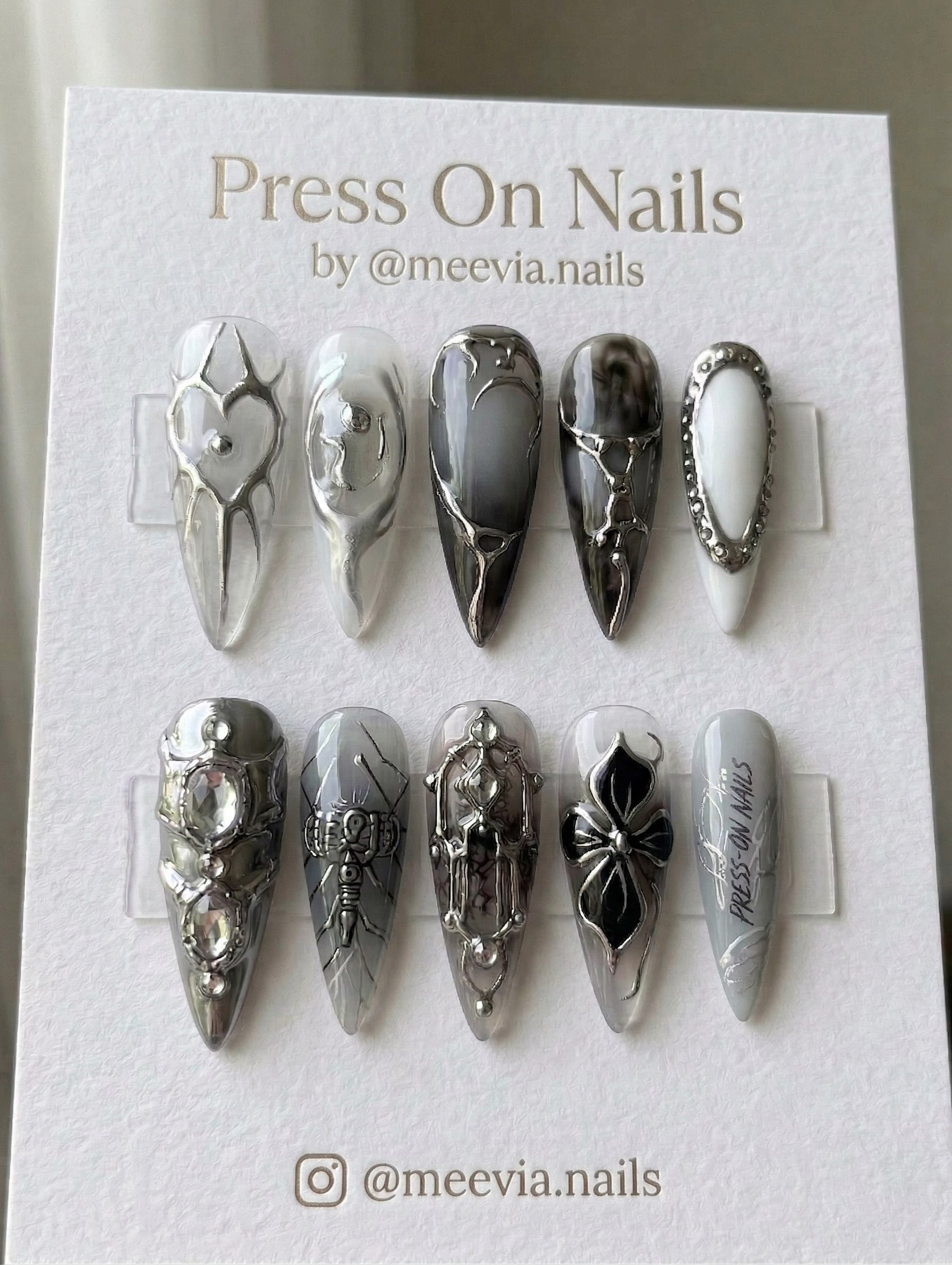 Long stiletto press-on nails with grey and silver 3D gothic nail art and chrome accents