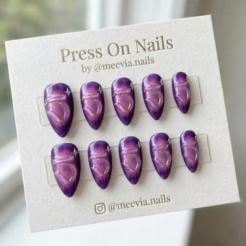 Almond-shaped press on nails with 3D clear hearts and silver chrome organic accents