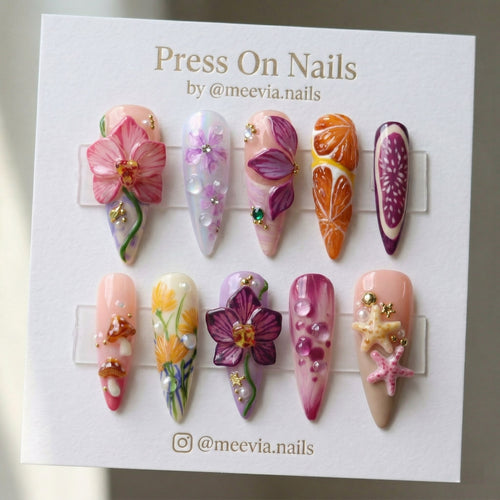 Stiletto-shaped press on nail set with 3D orchids, fruit slices, and botanical art