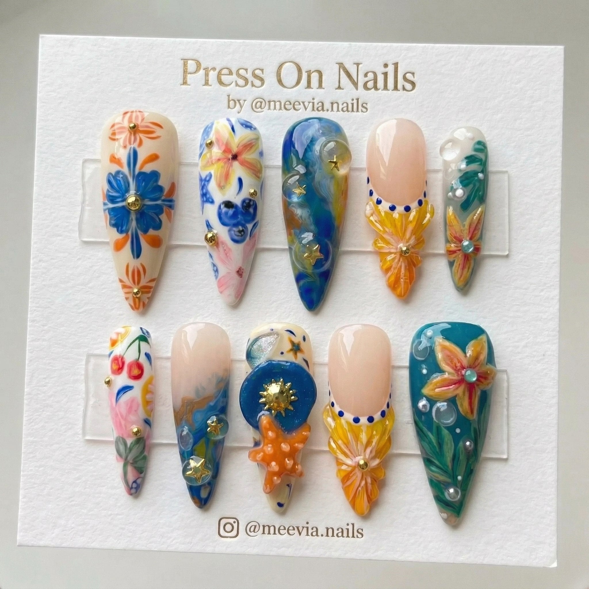 Stiletto-shaped tropical ocean press-on nail set with 3D starfish and floral art